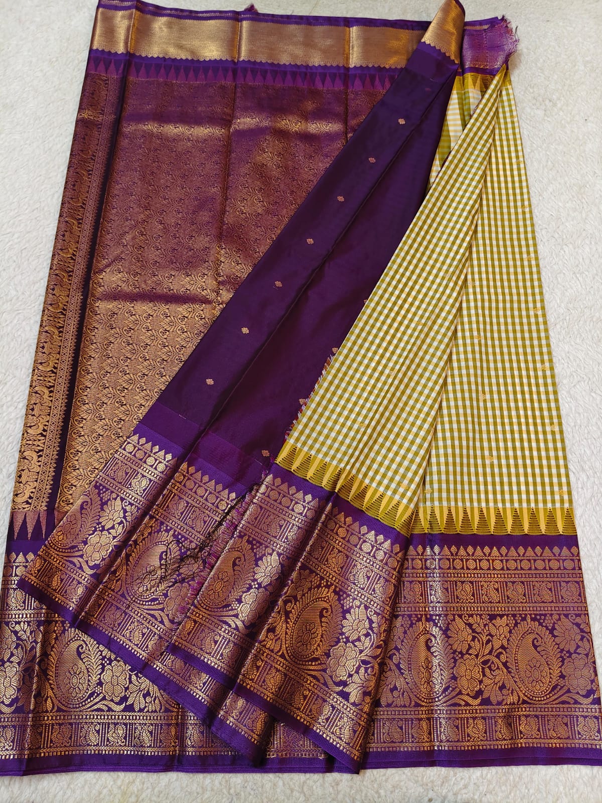 Semi Gadwaal Pattu purple and gold woven saree with a checkered yellow and gold body, a solid purple pallu