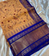 Gadwal Cotton Beige saree with  wide zari gold and blue border