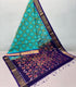 Ikkat cotton Turquoise and teal blue base with geometric ikat diamond patterns.