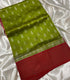 Mangalagiri Pattu olive green silk saree with small white leaf motifs and a wide red border