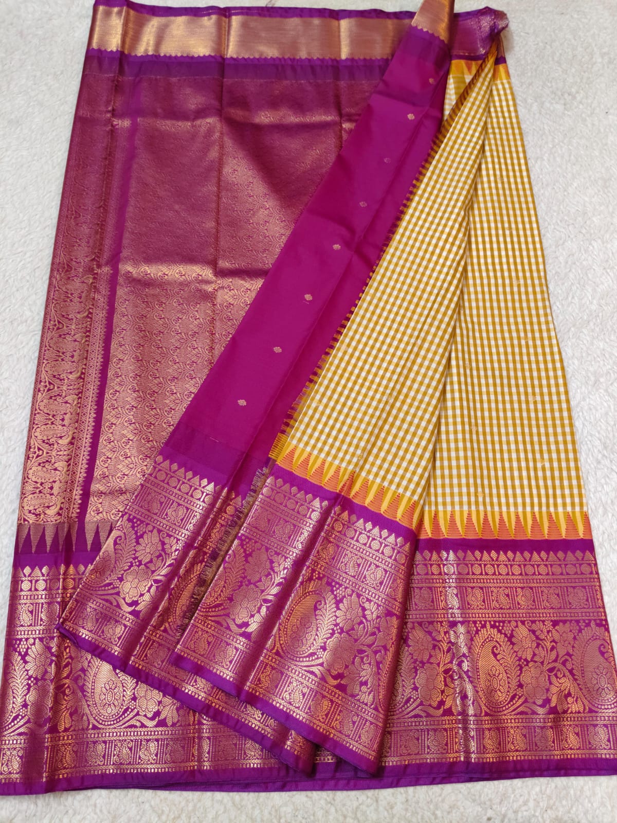 Semi Gadwaal Pattu Yellow and white checkered body, a rich magenta purple border,