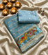 Viscose Georgette sky blue base with grid pattern and delicate silver or gold floral motifs.