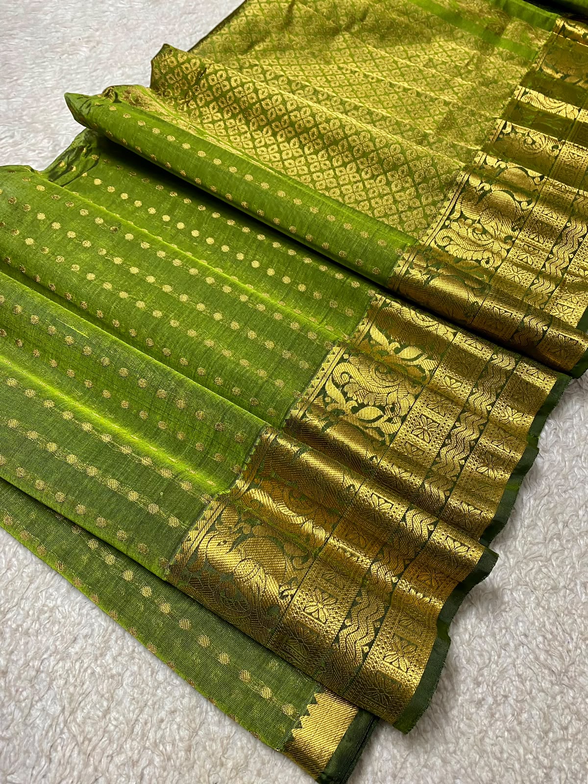 SIco Gadwal green body with small gold zari motifs and a broad gold zari brocade border