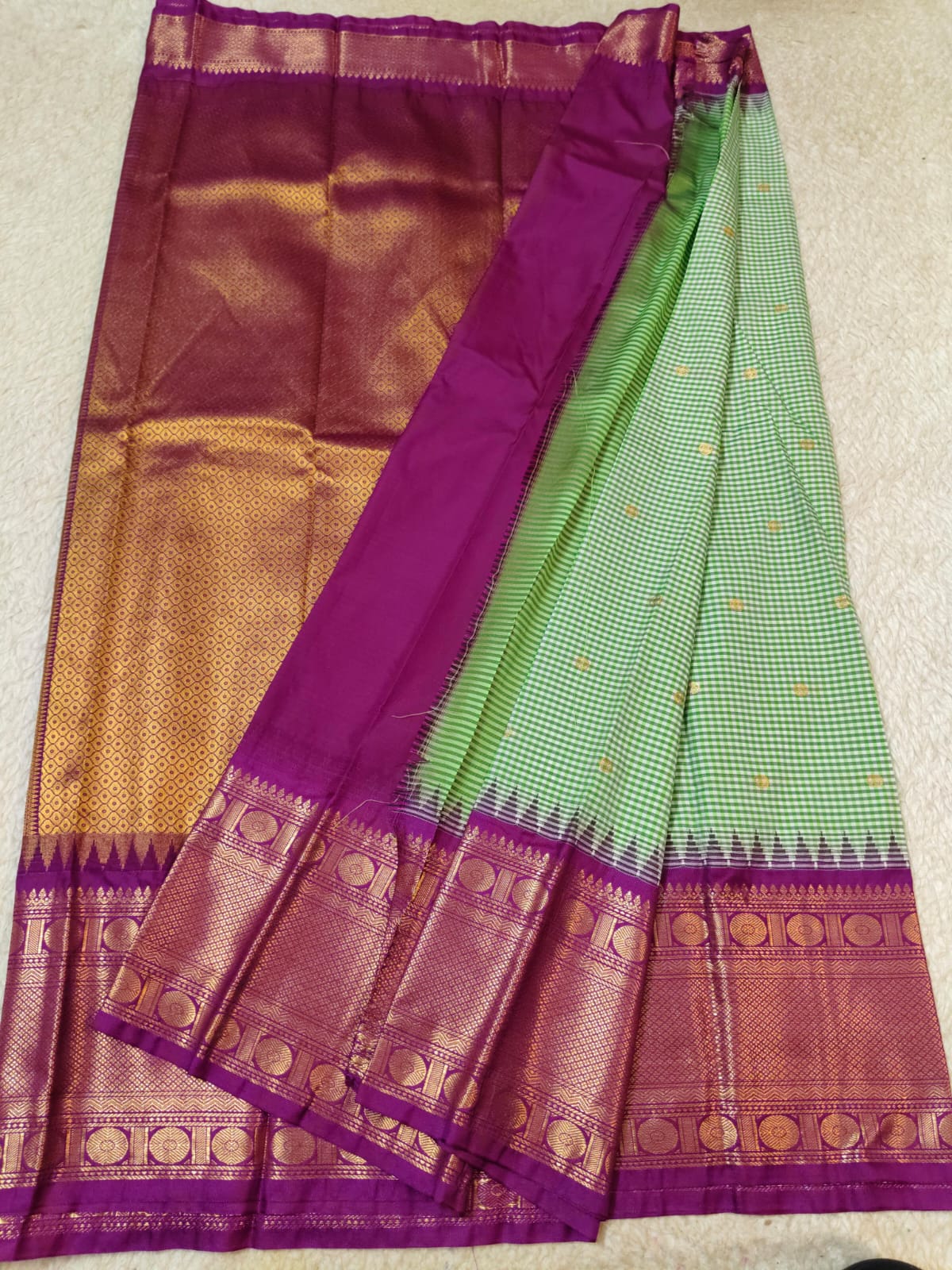 Semi Gadwaal Pattu light green body with a small checkered pattern, a wide magenta-purple border