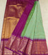 Semi Gadwaal Pattu light green body with a small checkered pattern, a wide magenta-purple border